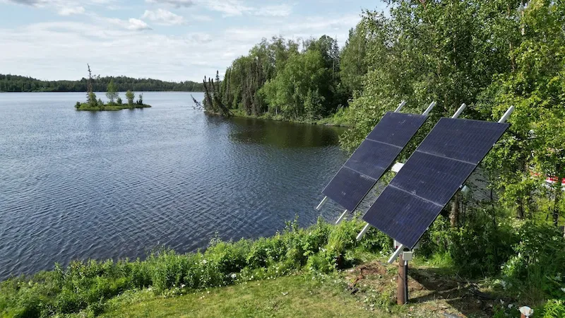 alaskan solar panel next to water lake